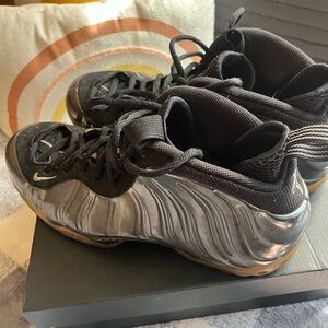 Nike Metallic Silver and Black Foamposite Athletic Sneakers